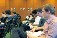 workshop participants listening to talk