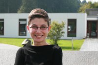 early career researcher standing in front ofe the MFO building