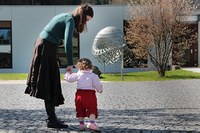 mother with her child in front of the institute